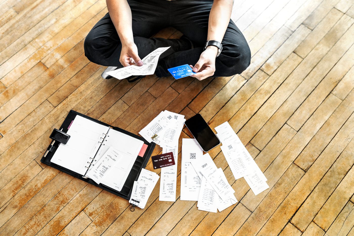 Cleanup bookkeeping — receipts spread on a floor